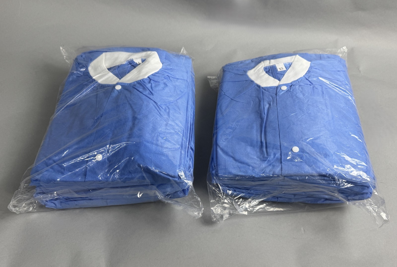 LOT OF 40 ULINE S-42018BLU-X DISPOSABLE LAB COATS: blue, unisex, XL|010-9278029