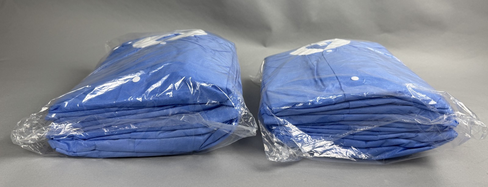 LOT OF 40 ULINE S-42018BLU-X DISPOSABLE LAB COATS: blue, unisex, XL|010-9278029