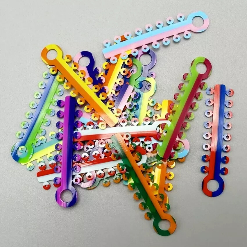 Ligaduras de ortodoncia dental Bandas elásticas Ligature Tie Single/Double Color